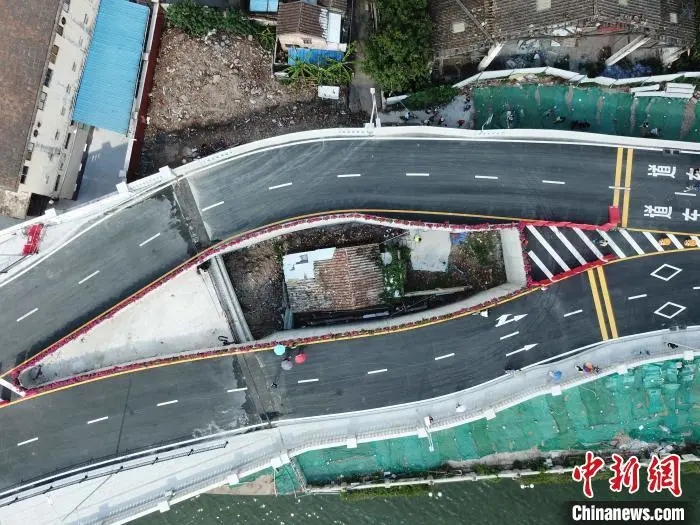 广州海珠涌大桥的“桥中房”屋主:搬迁房源对着医院太平间 所以不愿去
